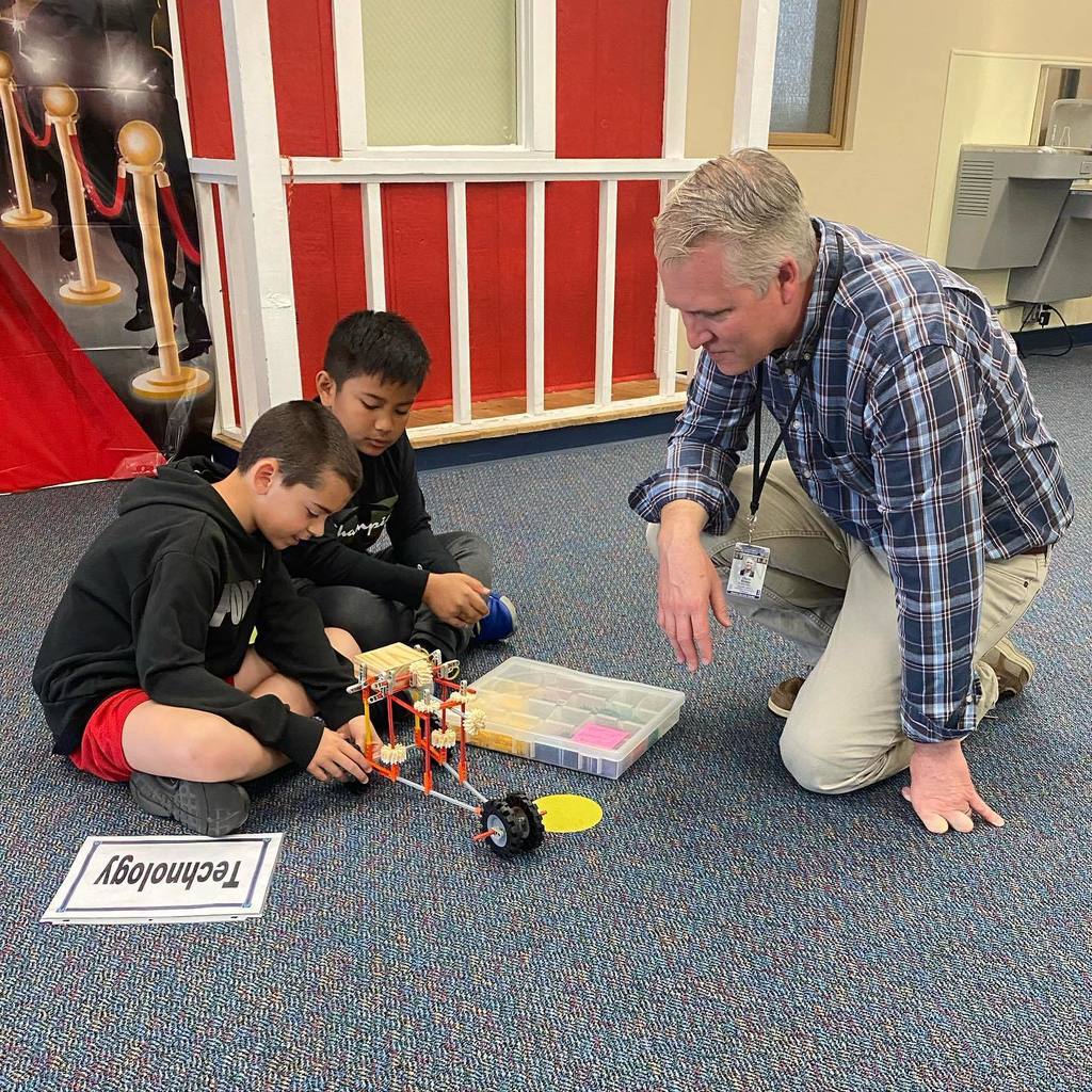 chris stoker with student robotics project