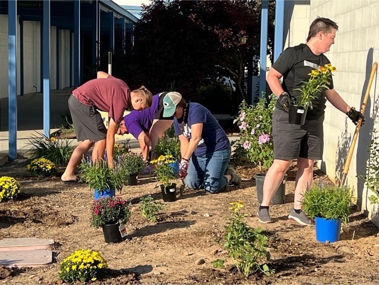 McMillan Elementary parents plant at the front of the school